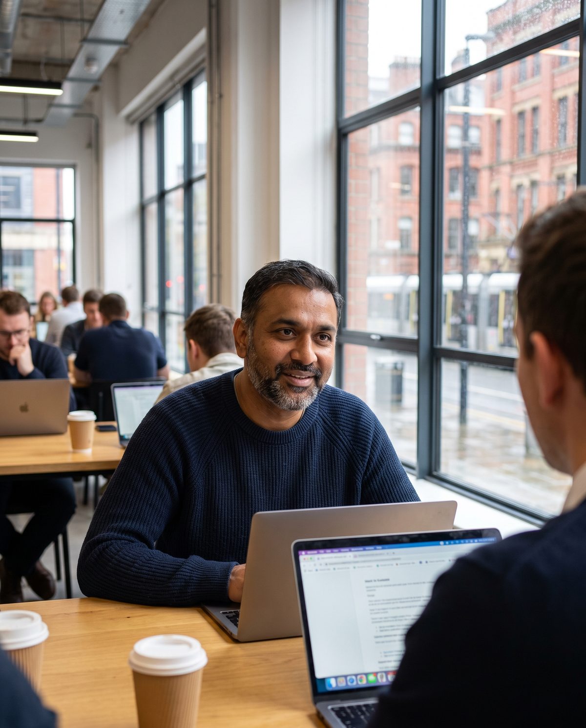 Contractor working on a laptop in a Manchester co-working space